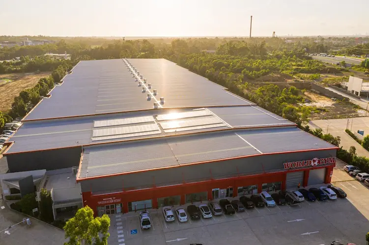 Aerial view of a 110kW solar panel system installed on the World Gym building roof